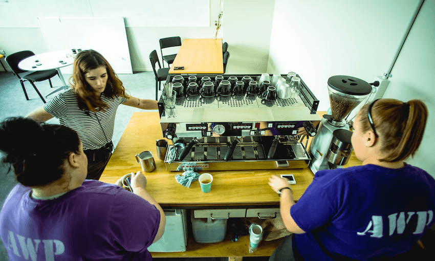 Trade School Industries’ Lauren Tennent with two Arohata Prison inmates and trainee baristas.  
