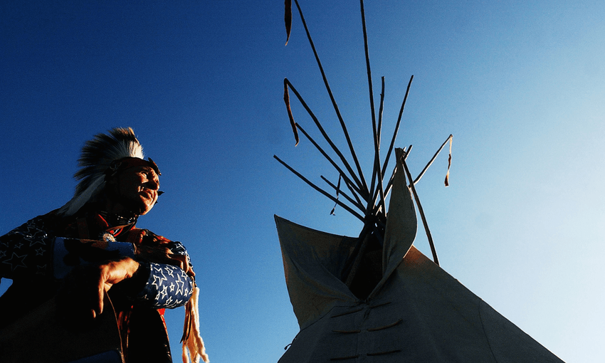 A Cherokee man at a traditional Pow-Wow. Photo by Jerome Pollos/Getty Images 
