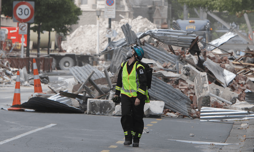 A Search and Rescue worker walks through the central business district during a search of earthquake damaged buildings in Christchurch on March 2, 2011. (Photo: MARK BAKER/AFP/Getty Images)