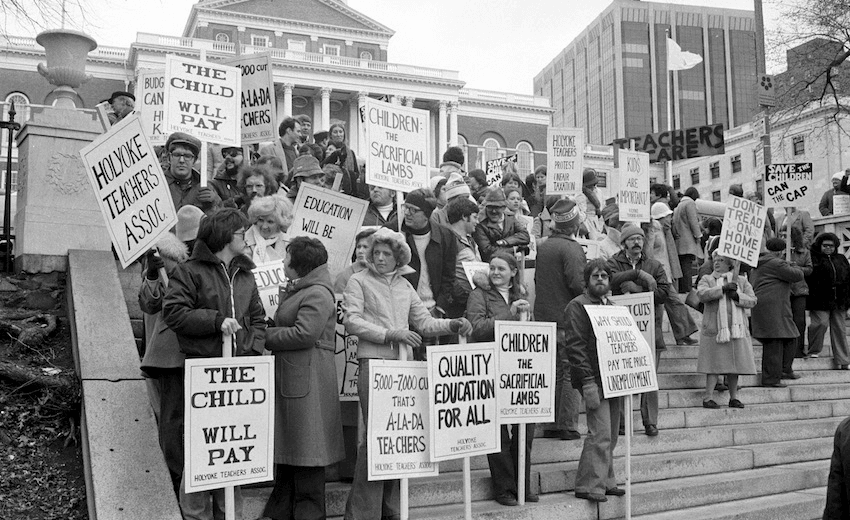 Teachers hold signs and march together during a strike protesting for better working conditions, Boston, 1969. (Photo by Spencer Grant/Getty Images) 
