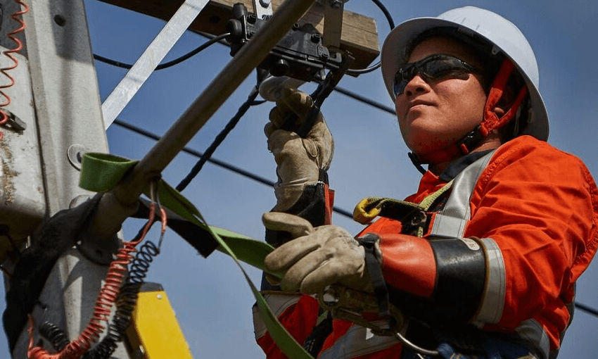 Northpower line mechanic Eseta at work up in the bucket.  
