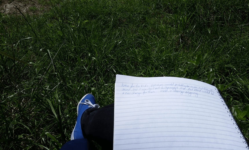 A mum writes at the retreat while her children are cared for. 
