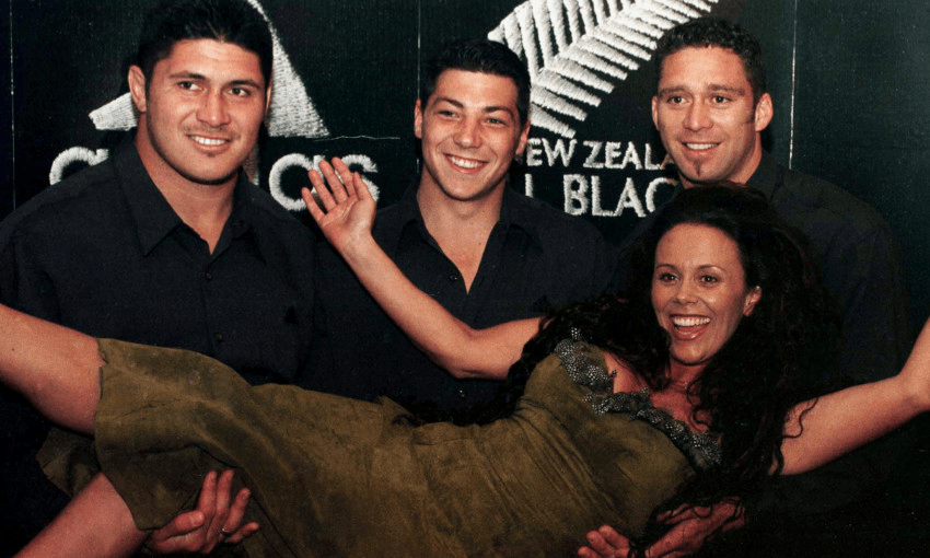 Singer Hinewehi Mohi with All Blacks Carl Hoeft, left, Byron Kelleher and Glen Osborne. Image: Ross Setford/Getty Images.