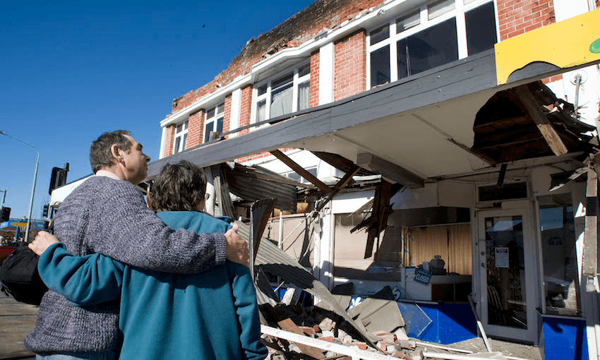 A couple inspect damaged buildings after a 7.1 magnitude earthquake struck 30km west of Christchurch, September 4, 2010. Image: Joseph Johnson/Getty Images 
