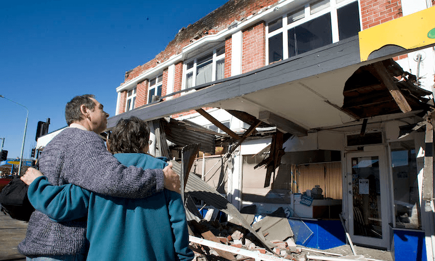 A couple inspect damaged buildings after a 7.1 magnitude earthquake struck 30km west of Christchurch, September 4, 2010. Image: Joseph Johnson/Getty Images