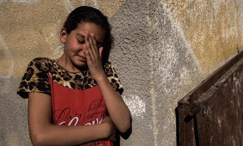 A relative of Palestinian Mahmoud Abu Taima, who was killed during a protest at the Israel-Gaza border, mourns during his funeral in Khan Yunis in the southern Gaza Strip on May 14, 2018. Photo: SAID KHATIB/AFP/Getty Images 

