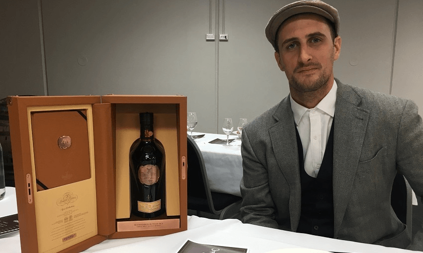 Glenfiddich’s New Zealand ambassador, Tom Fastier, with the Glenfiddich 40-year-old (Photo: Hayden Donnell) 
