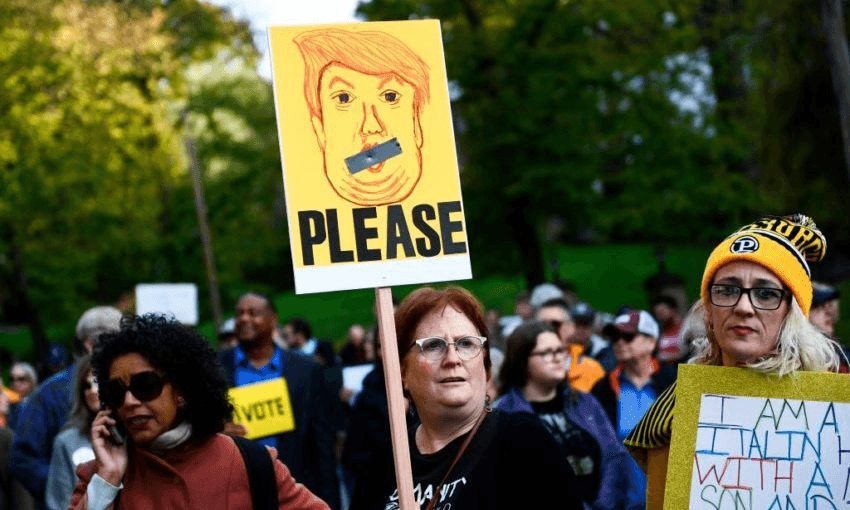 Anti-Trump protesters wait near the Tree of Life Congregation on October 30, 2018 in Pittsburgh. Photo: BRENDAN SMIALOWSKI/AFP/Getty Images 
