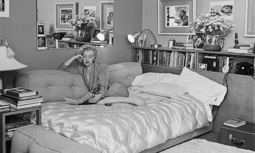 Marilyn Monroe reading ‘The Poetry and Prose of Heinrich Heine’. (Photo by Archive Photos/Getty Images) 
