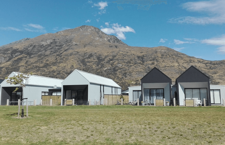photo of stand-along homes with mountain in the background