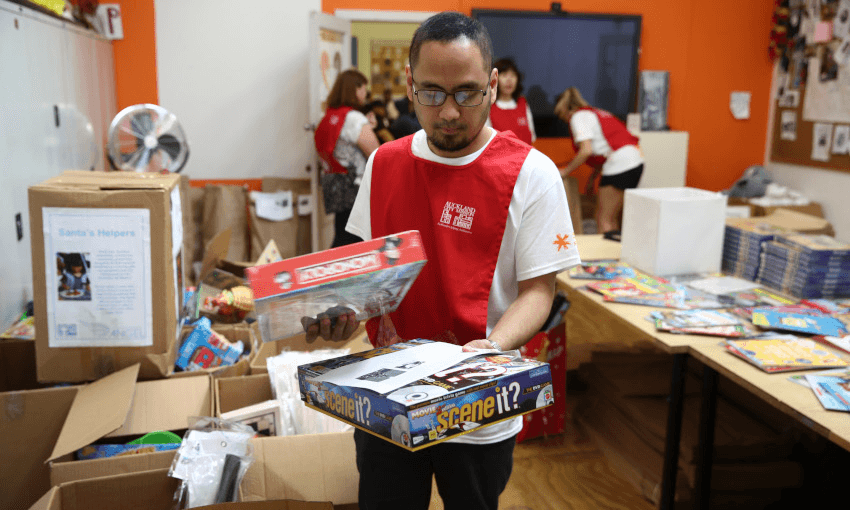 Auckland City Mission volunteers prepare Christmas presents for families in need over Christmas on December 13, 2017 in Auckland. Photo by Phil Walter/Getty Images 
