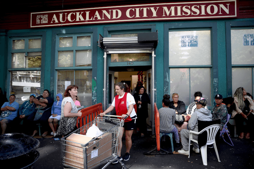 Auckland City Mission volunteers bring out parcels of food and presents for families (Photo: Phil Walter/Getty Images) 
