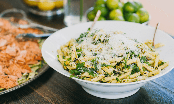 Roast chicken can be shredded and tossed with cooked pasta, loads of lemon, rocket, parmesan and olive oil for the simplest pasta salad to feed a crowd (Photo: Libby Robinson) 
