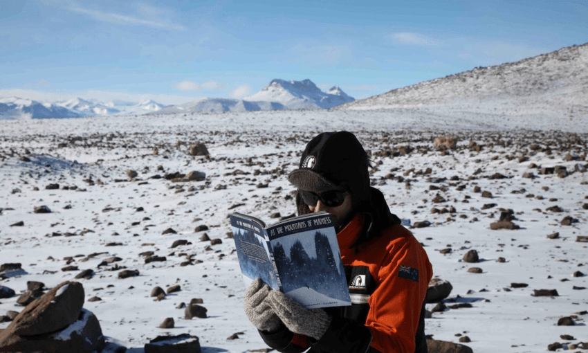 Rebecca Priestley having a read on the ice of Antarctica in 2014 (Photo: Cliff Atkins)  
