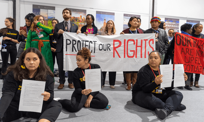 Representatives of the indigenous peoples’ caucus protest at the World Climate Summit (Photo: Monika Skolimowska via Getty Images) 
