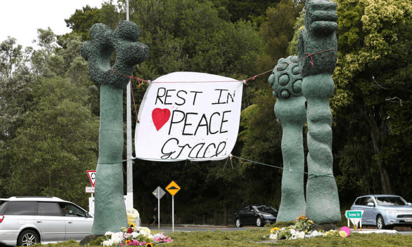Tributes to Grace Millane at the  roundabout in Titirangi, Auckland (Photo by Fiona Goodall/Getty Images 
