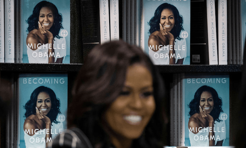Michelle Obama signs copies of her new book ‘Becoming’ (Photo by Drew Angerer/Getty Images) 
