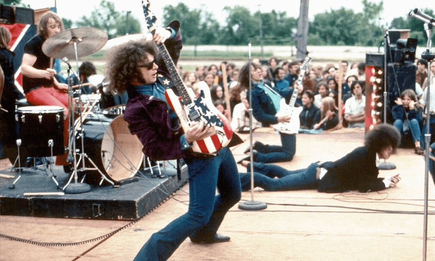 MOUNT CLEMENS, MI – 1969:  The rock group MC5  (L-R Dennis “Machine Gun” Thompson, Wayne Kramer, Fred “Sonic” Smith and  Rob Tyner) perform live in 1969 in Mount Clemens, Michigan.  (Photo by Leni Sinclair/Michael Ochs Archive/Getty Images) 
