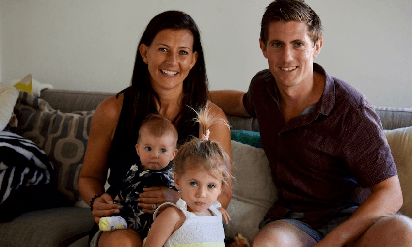 Jaco Kluts and his family, wife Dom, and daughters India (6 months) and Addison (2) (Image: Tina Tiller/The Spinoff).  
