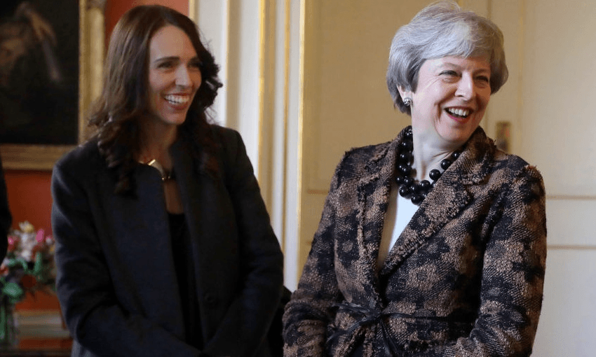 Britain’s Prime Minister Theresa May, right, laughs during a meeting with New Zealand’s Prime Minister Jacinda Ardern, left, and military personnel in Downing Street in London, Monday, Jan. 21, 2019. (AP Photo/Kirsty Wigglesworth, pool) 
