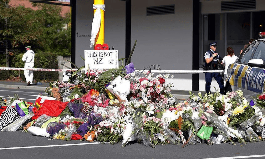Residents pay respect by placing flowers for the victims of the mosques attacks in Christchurch on March 16, 2019. (TESSA BURROWS/AFP/Getty Images) 
