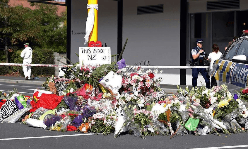 Residents pay respect by placing flowers for the victims of the mosques attacks in Christchurch on March 16, 2019. (TESSA BURROWS/AFP/Getty Images)