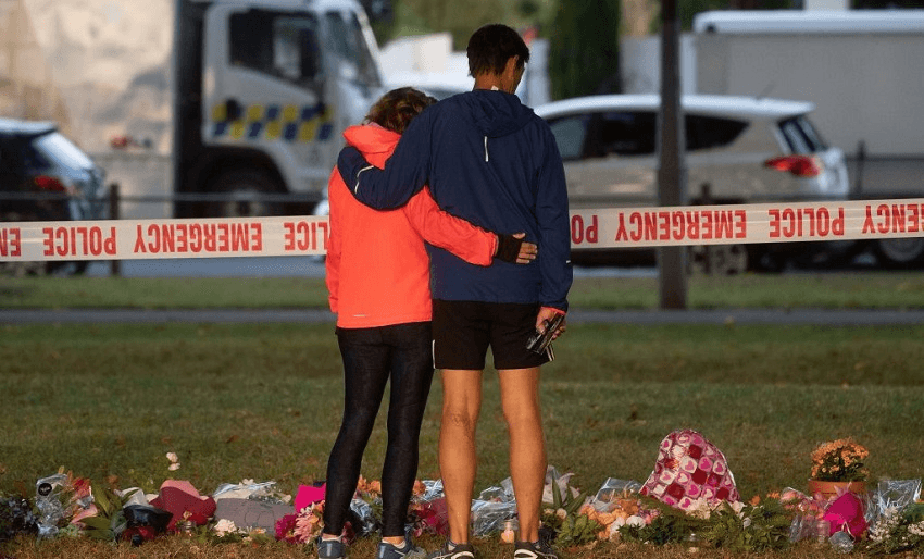 Tributes across the road from the Dean Avenue mosque in Christchurch, New Zealand shortly after March 15, 2019 (Photo: MARTY MELVILLE/AFP/Getty Images) 
