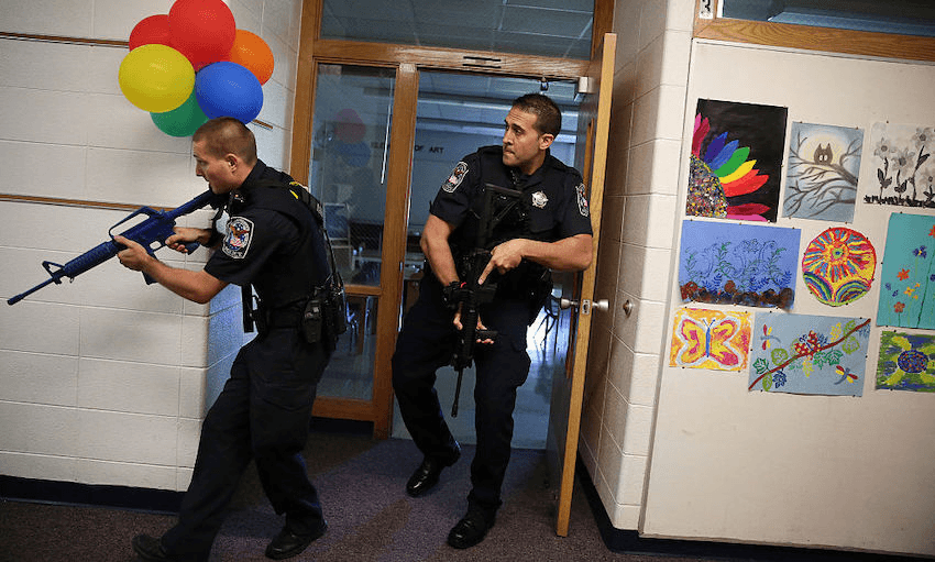 Two police officers participate in an active shooter drill on Saturday, Sept. 12, 2015 at Oak Knoll School in Cary, Illinois. (Anthony Souffle/Chicago Tribune/TNS) 
