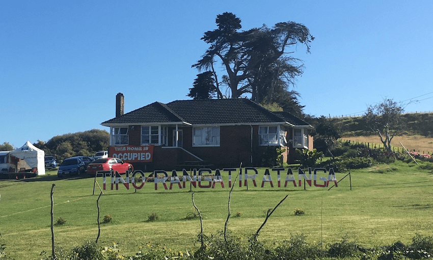 A red brick house sits on Fletchers’-owned land between the Ōtuataua Stonefields and the ‘Wallace block’. SOUL activists now occupy the brick house as their base of operations. Photo: Leonie Hayden 
