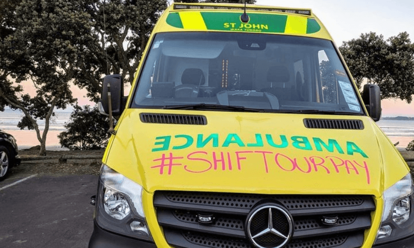 An ambulance with a campaign message scrawled on the front (Facebook – Ambulance Professionals First)  
