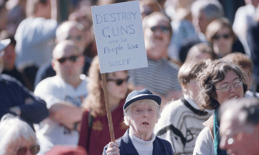 A protester holds a sign reading ‘Destroy guns and let people live’ at a rally in the park outside the Tasmanian Parliament House, in the days after the Port Arthur massacre (Photo by Fairfax Media/Fairfax Media via Getty Images) 
