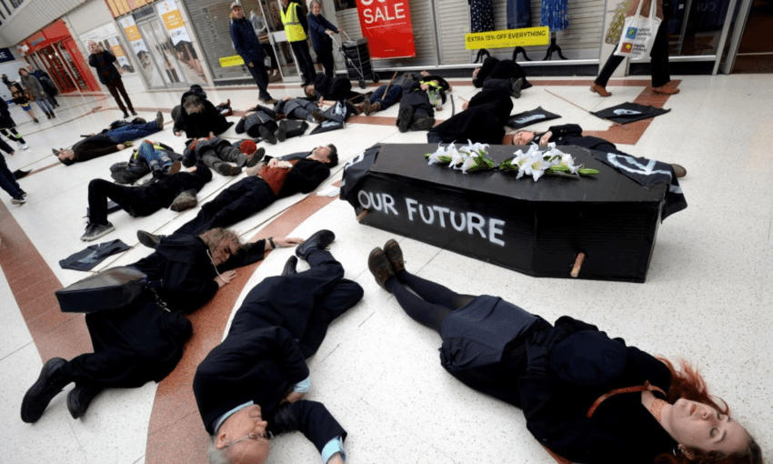 Extinction Rebellion protesters in England holding a ‘die-in’ along with a mock funeral to protest government and business inaction on climate change earlier this year (Photo: Getty Images)  
