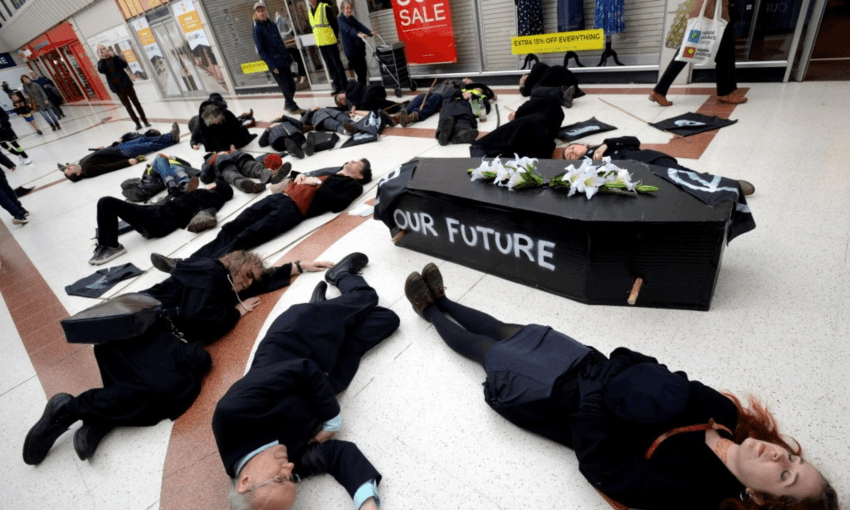 Extinction Rebellion protesters in England holding a ‘die-in’ along with a mock funeral to protest government and business inaction on climate change earlier this year (Photo: Getty Images)