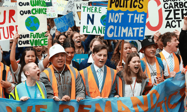 Students march through the streets of Wellington during the climate strike. (Photo by Hagen Hopkins/Getty Images) 
