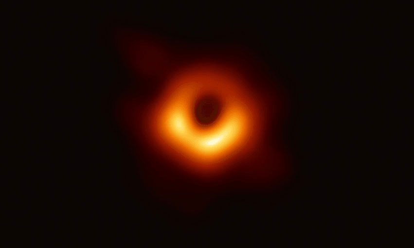 The Event Horizon Telescope captures a black hole at the center of galaxy M87, outlined by emission from hot gas swirling around it under the influence of strong gravity near its event horizon, in an image released on April 10, 2019. (Photo by National Science Foundation via Getty Images) 
