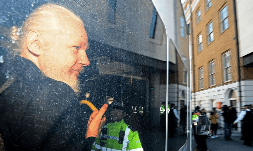 Julian Assange, now with a beard, after being arrested in London (Getty Images) 

