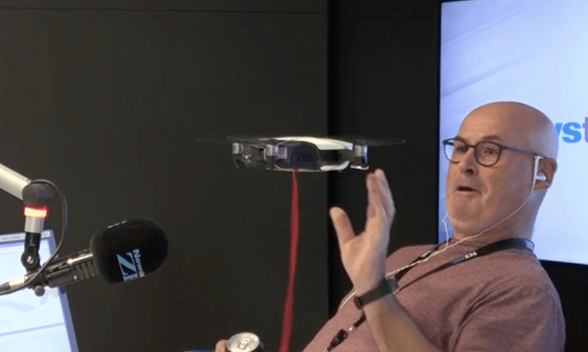 Larry Williams fending off a drone (Image: Newstalk ZB) 
