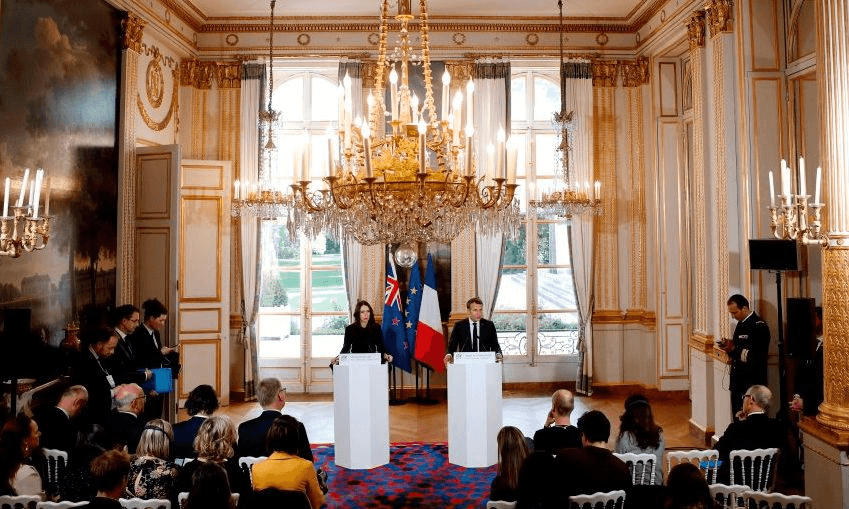 NZ prime minister Jacinda Ardern and French President Emmanuel Macron address the press on the Christchurch Call at the Elysee Palace in Paris, 2019. (Photo: YOAN VALAT/AFP/Getty Images) 
