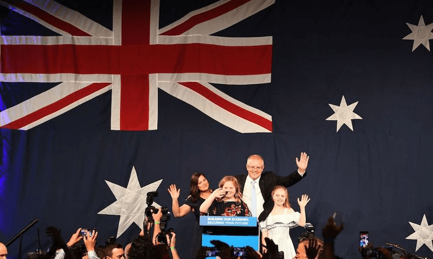 Australia’s Prime Minister Scott Morrison waves to his supporters following a victory speech with his family after winning the Australia’s general election in Sydney on May 18, 2019. (Photo: SAEED KHAN/AFP/Getty Images) 
