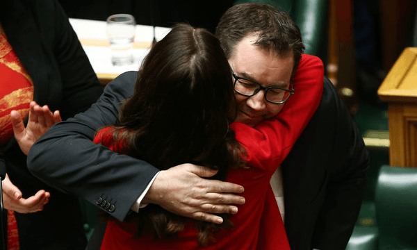 Grant Robertson embraces Prime Minister Jacinda Ardern after delivering the 2019 budget presentation at Parliament (Photo by Hagen Hopkins/Getty Images) 
