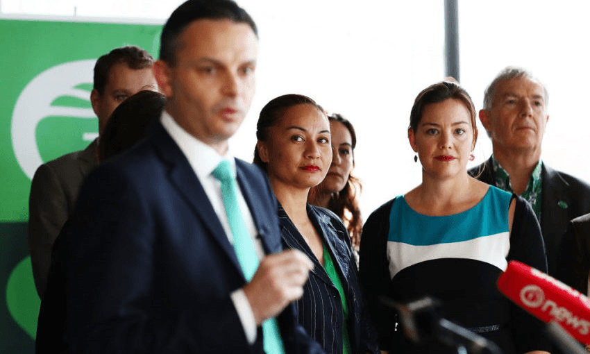 Marama Davidson and Julie Ann Genter listen to Green Party co-leader James Shaw speak in 2017 (Photo by Hannah Peters/Getty Images) 
