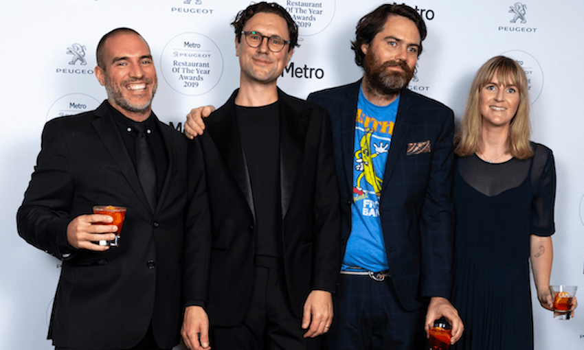 Metro editor Henry Oliver and Spinoff food section contributor/man about town Samuel Flynn Scott flanked by Dietary Requirements’ Simon Day and Alice Neville at the Metro Restaurant of the Year Awards at Auckland town hall (Photo: Metro) 
