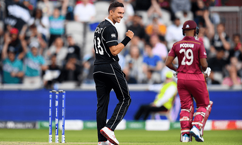 Trent Boult of New Zealand celebrates dismissing Nicholas Pooran. Photo by Clive Mason/Getty Images 
