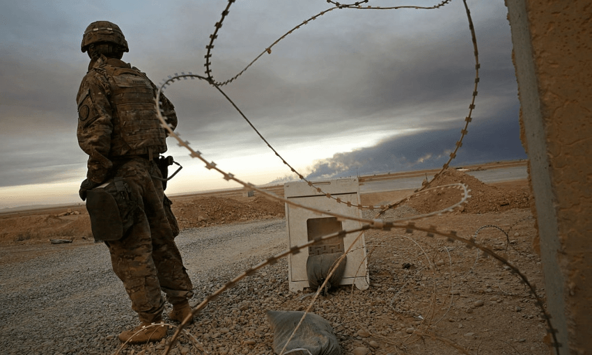 QAYYARAH AIRFIELD WEST, IRAQ An unidentified Coalition soldier at Qayyarah West Airfield, during the attack on Mosul (Carolyn Cole/Getty Images via Los Angeles Times) 
