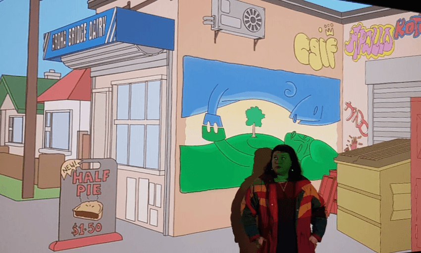 Writer/director Coco Solid “outside” the Aroha Bridge dairy. (Photo: supplied)