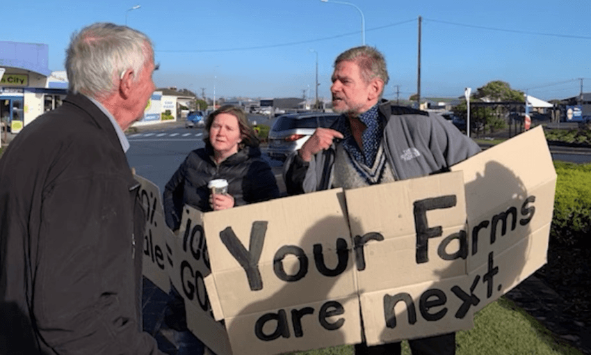 Former Westland director Jim Waflebakker arguing with protesters on the day of the sale (Radio NZ, Maja Burry) 
