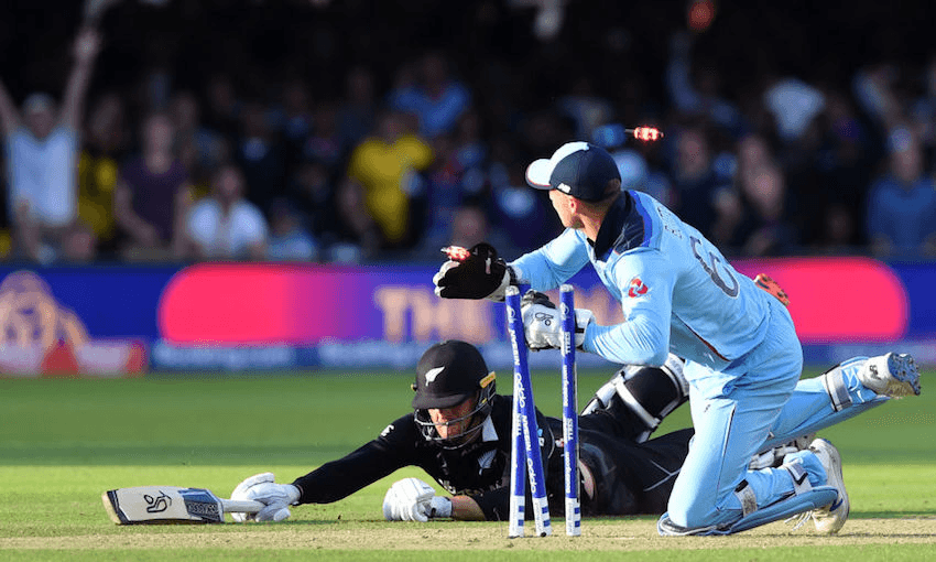 England’s Jos Buttler runs out New Zealand’s Martin Guptill to win the 2019 Cricket World Cup final between England and New Zealand at Lord’s Cricket Ground in London on July 14, 2019 (Photo: PAUL ELLIS/AFP/Getty Images) 
