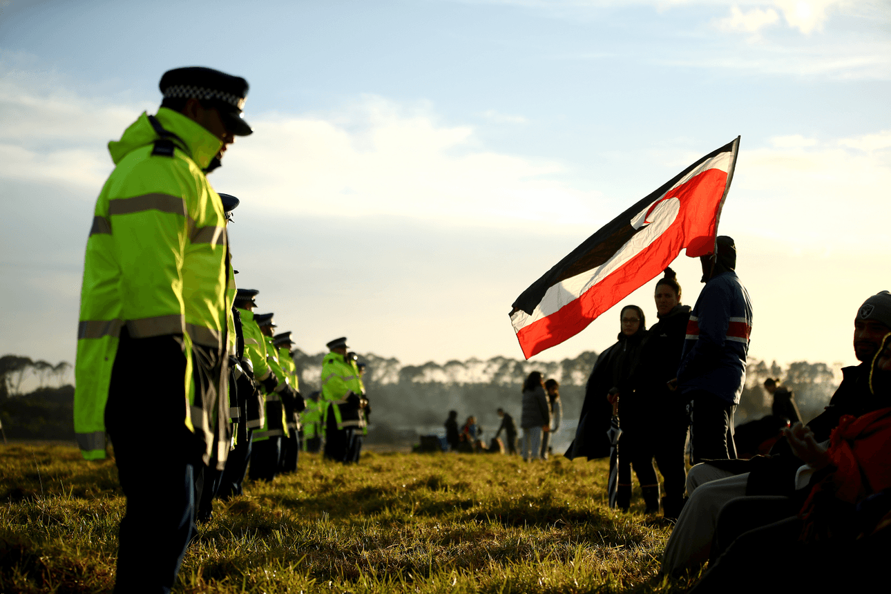 Campaigners gather at Ihumātao in opposition to the proposed Fletcher Building housing development on July 26. (Photo by Phil Walter/Getty Images). 
