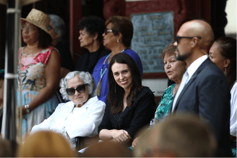 WAITANGI, NEW ZEALAND – FEBRUARY 05: Prime Minister Jacinda Ardern sits alongside Titewhai Harawira (L) for the powhiri on the upper marae at Waitangi on February 05, 2019 in Waitangi, New Zealand. The Waitangi Day national holiday celebrates the signing of the treaty of Waitangi on February 6, 1840 by Maori chiefs and the British Crown, that granted the Maori people the rights of British Citizens and ownership of their lands and other properties. (Photo by Phil Walter/Getty Images) 
