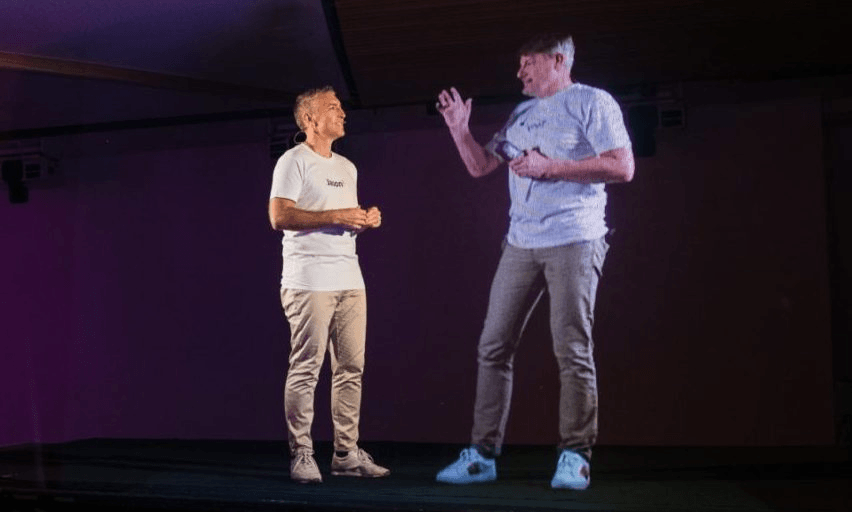Vodafone CEO Jason Paris interviews the holographic version of his technology boss Tony Baird. Photo: supplied 
